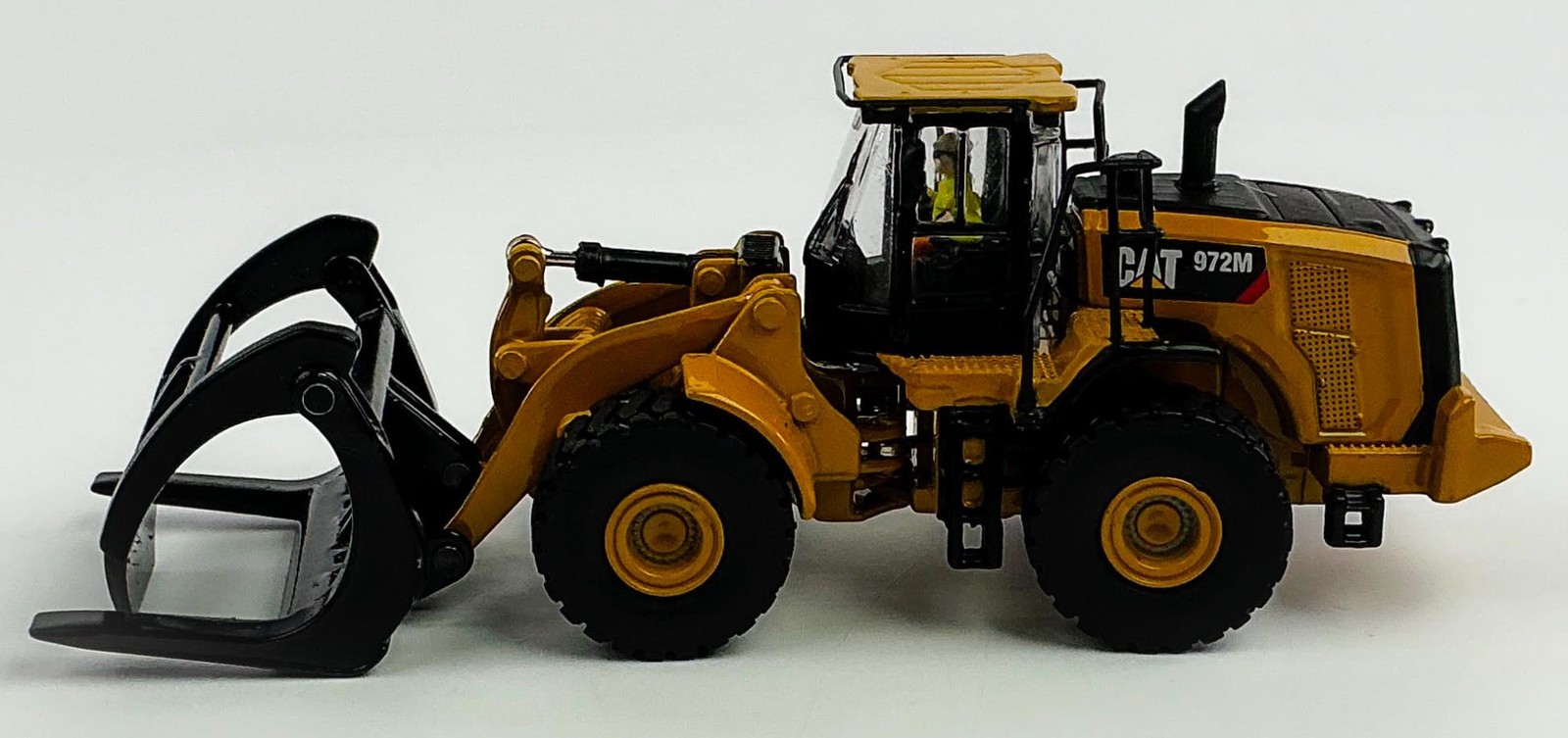 Diecast Masters 85950 Caterpillar 972M Wheel Loader with Log Fork 1/87 Scale