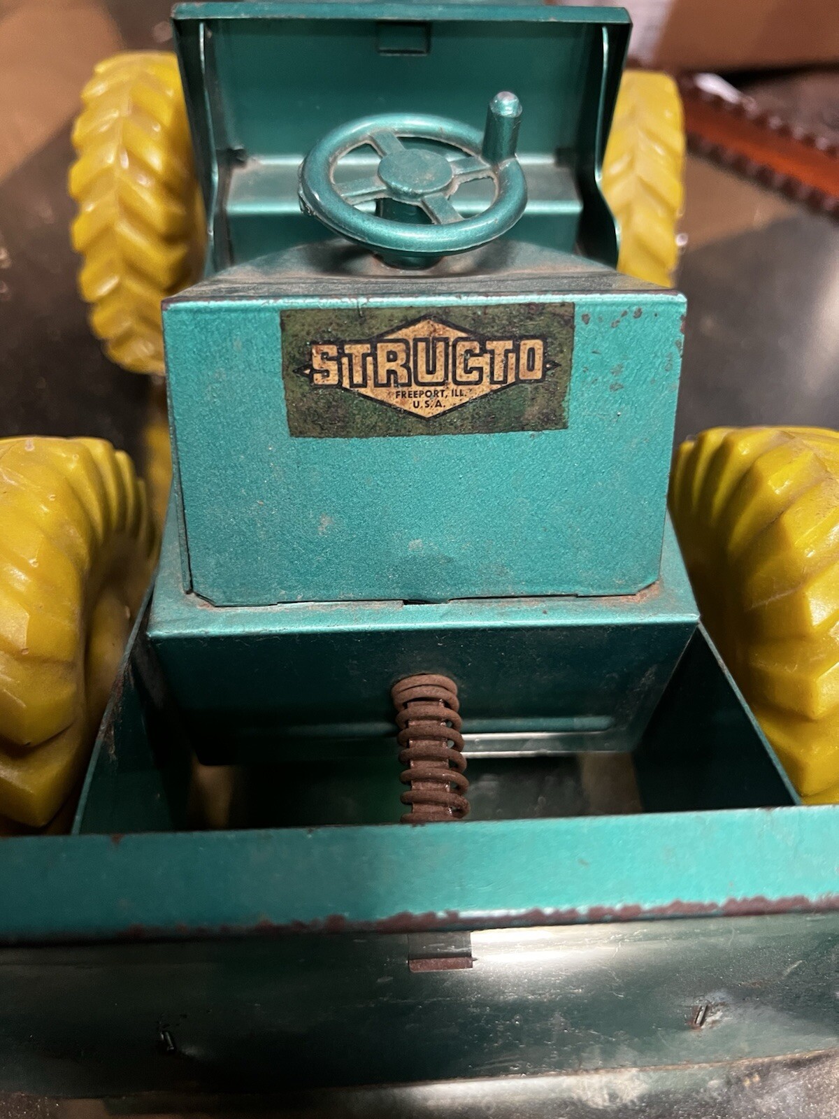 Vintage green Structo Bulldozer, Pressed Steel 12” long -original has play wear