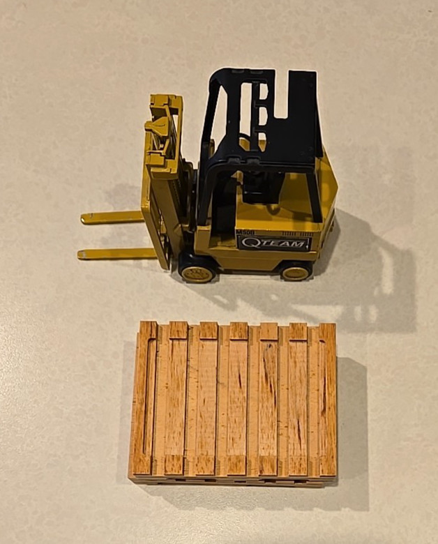 NZG Modelle #225 Diecast Forklift w/ 2 wooden pallets – Baxter Healthcare logo