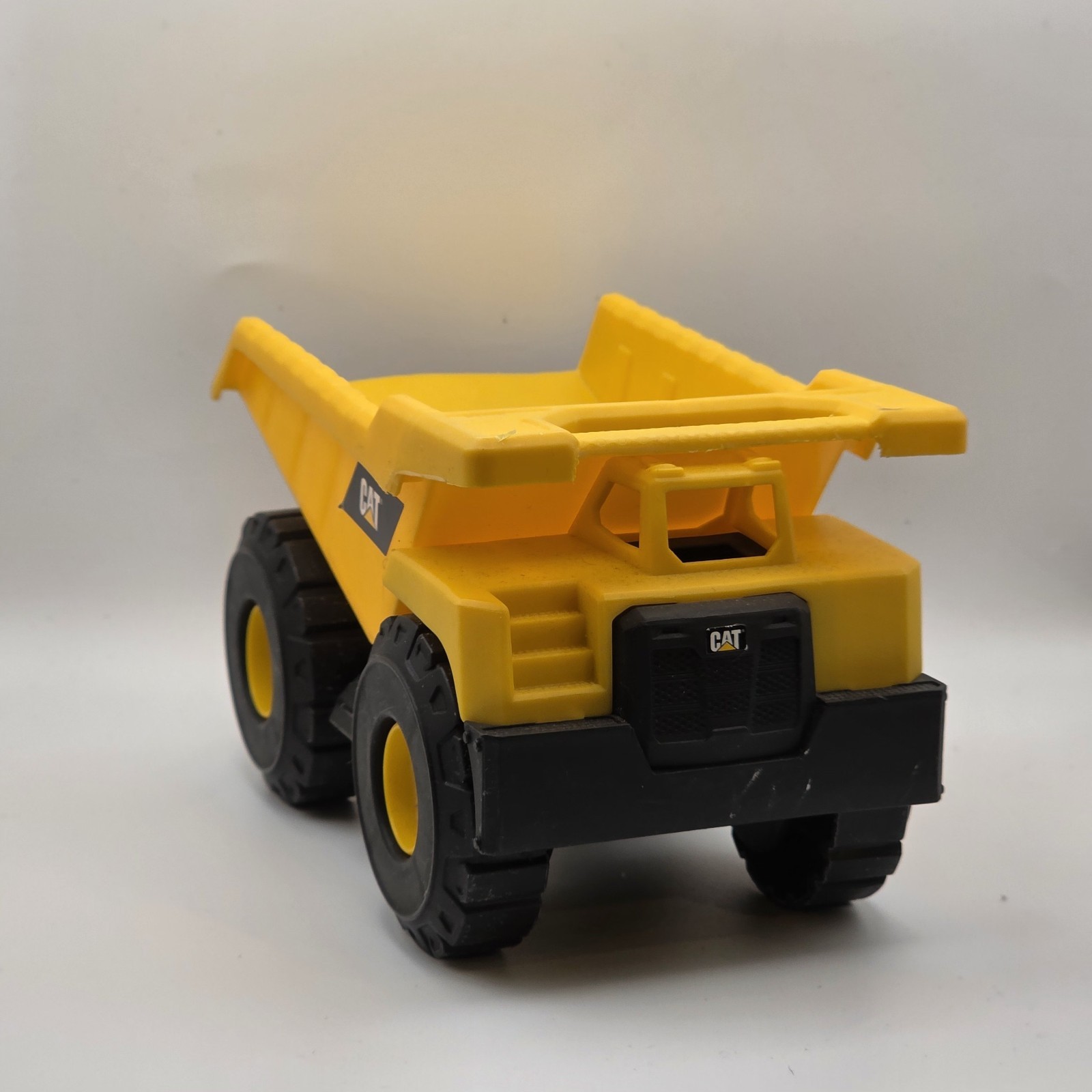 CAT Caterpillar Dump Truck Toy 7in Construction Vehicle Yellow Black
