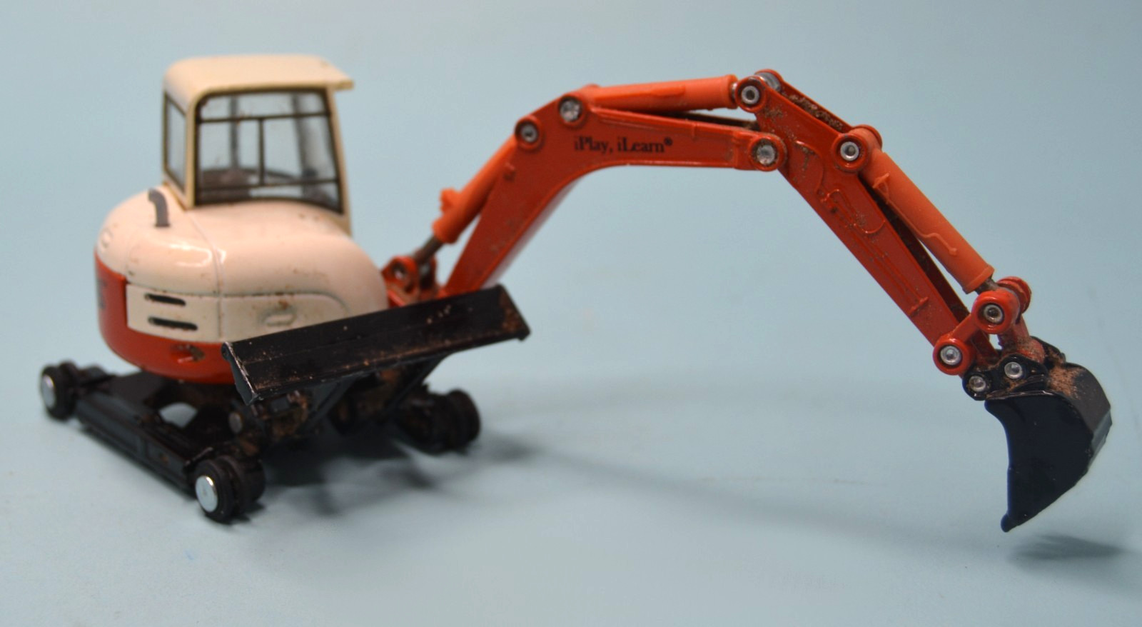 Diecast orange mini-track backhoe excavator