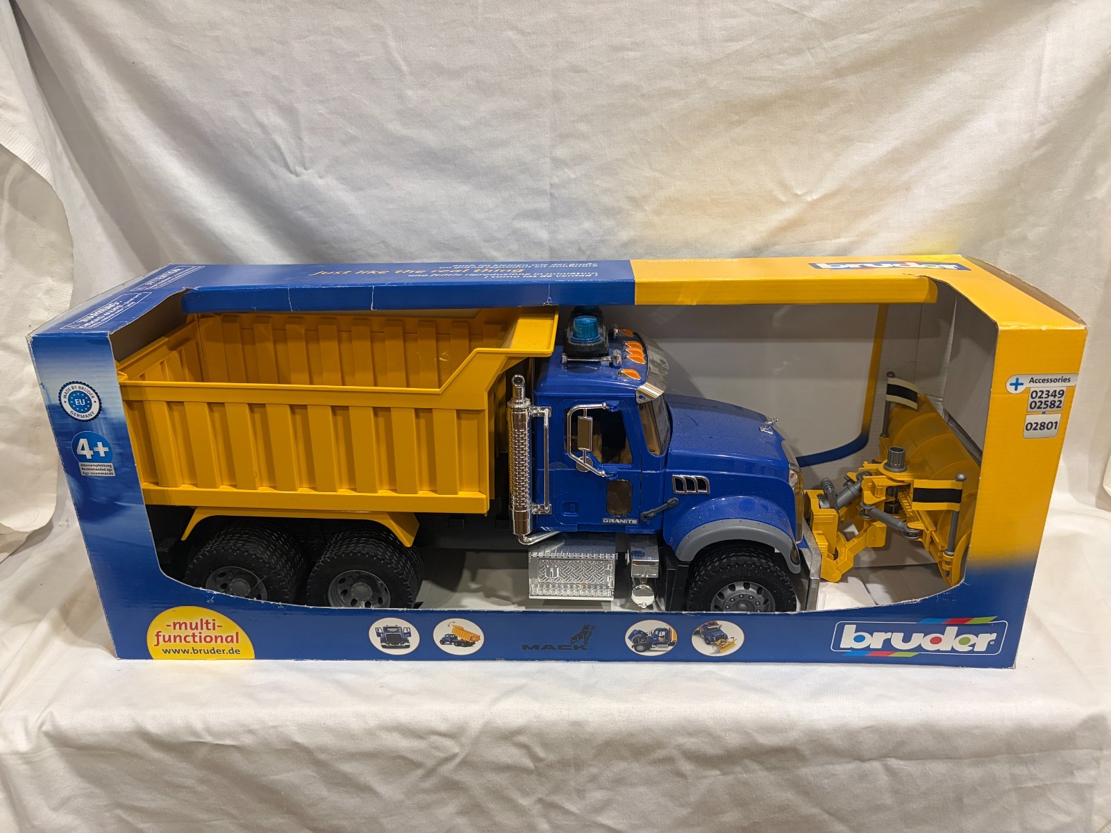 Bruder Mack Granite Snow Plow Dump Truck w/Light and Sound Bar (Open Box)