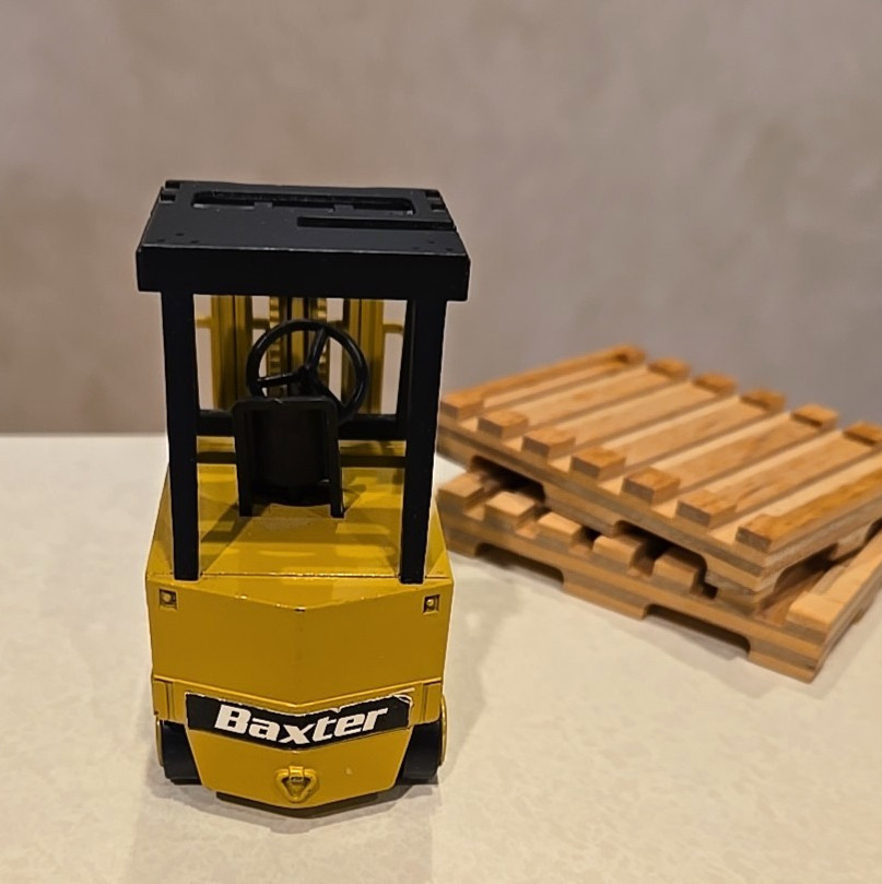NZG Modelle #225 Diecast Forklift w/ 2 wooden pallets – Baxter Healthcare logo