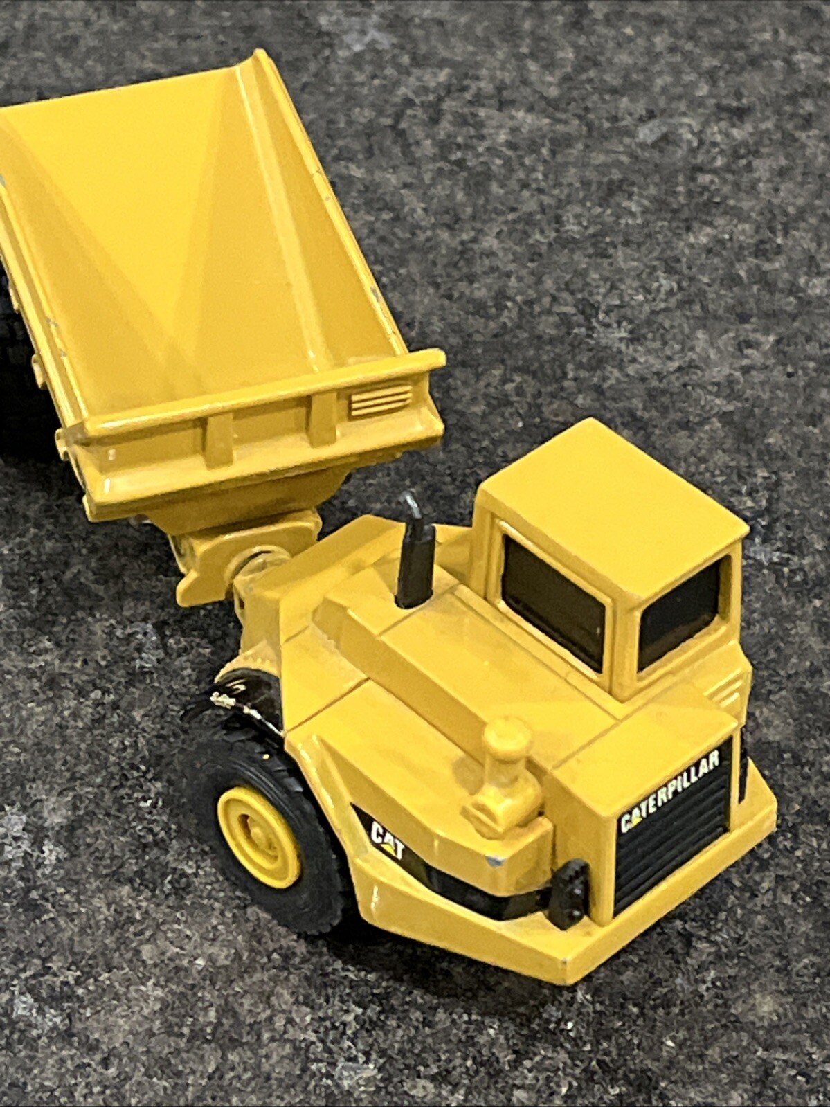 Vintage Ertl 5″ Articulated Caterpillar – D250, Rock Hauler Dump Truck – Yellow