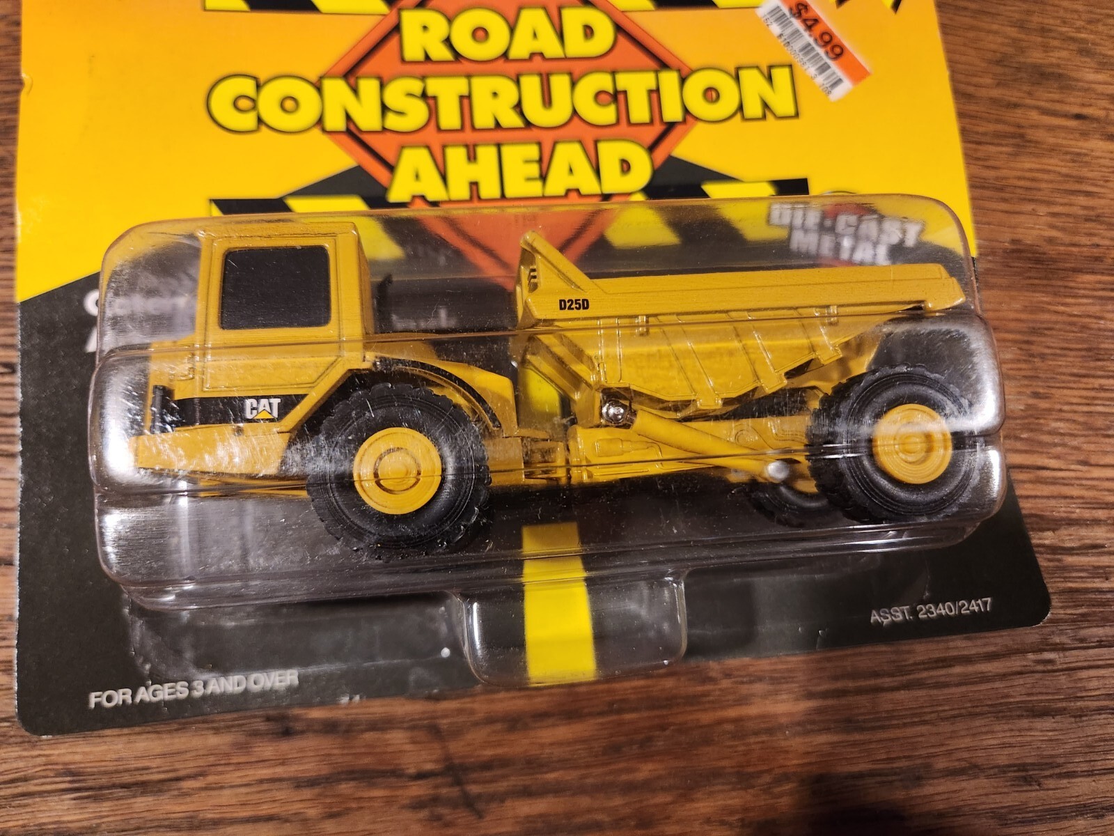 ERTL Caterpillar D25D Articulating Dump Truck Road Construction Ahead 1995