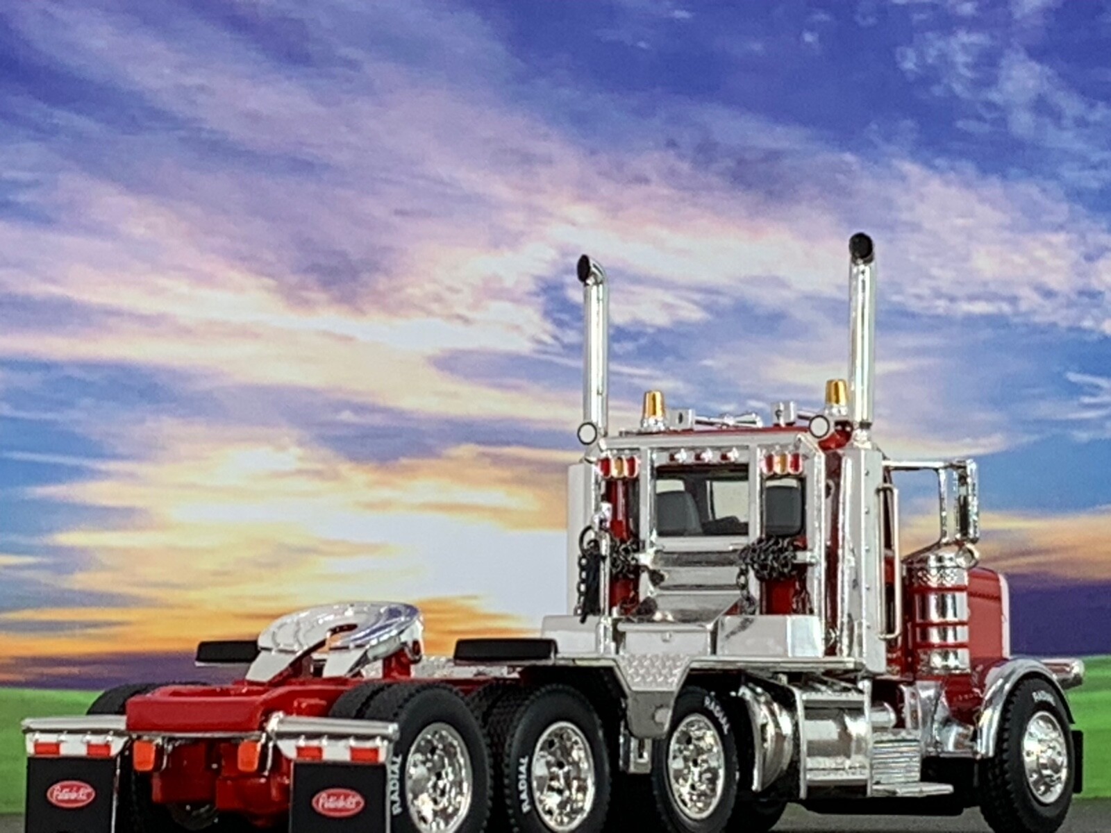 1/64 DCP RED PRIDE & CLASS PETERBILT 389 HEAVY HAUL TRI AXLE DAY CAB
