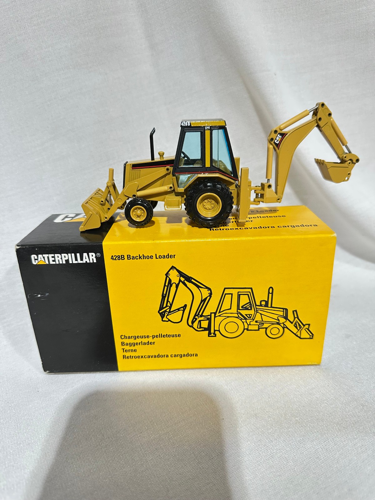 Caterpillar 428B Backhoe Loader By NZG 1/50th Scale