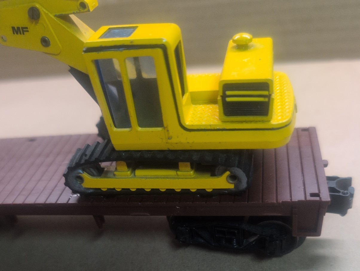 1/50 Scale Massey Ferguson MF450S Excavator on a Lionel O scale flatbed