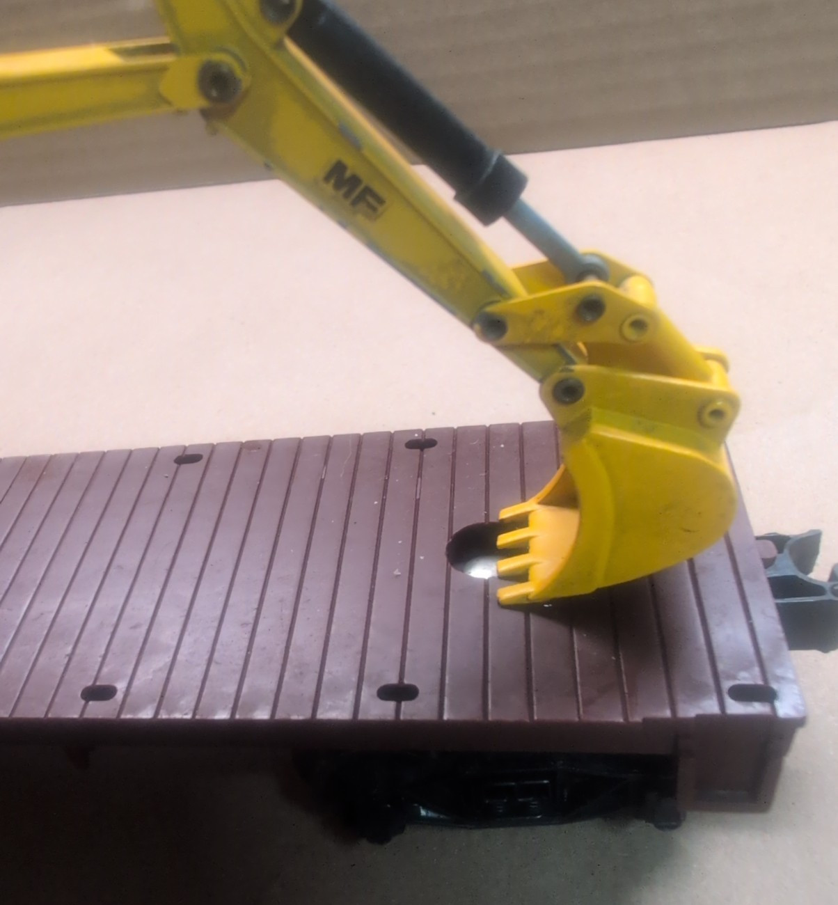 1/50 Scale Massey Ferguson MF450S Excavator on a Lionel O scale flatbed