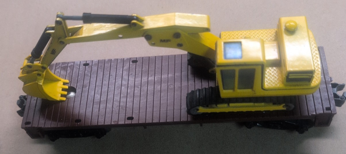 1/50 Scale Massey Ferguson MF450S Excavator on a Lionel O scale flatbed