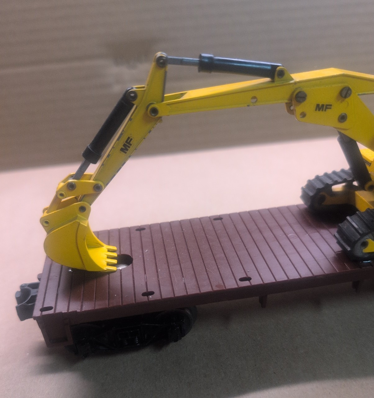 1/50 Scale Massey Ferguson MF450S Excavator on a Lionel O scale flatbed