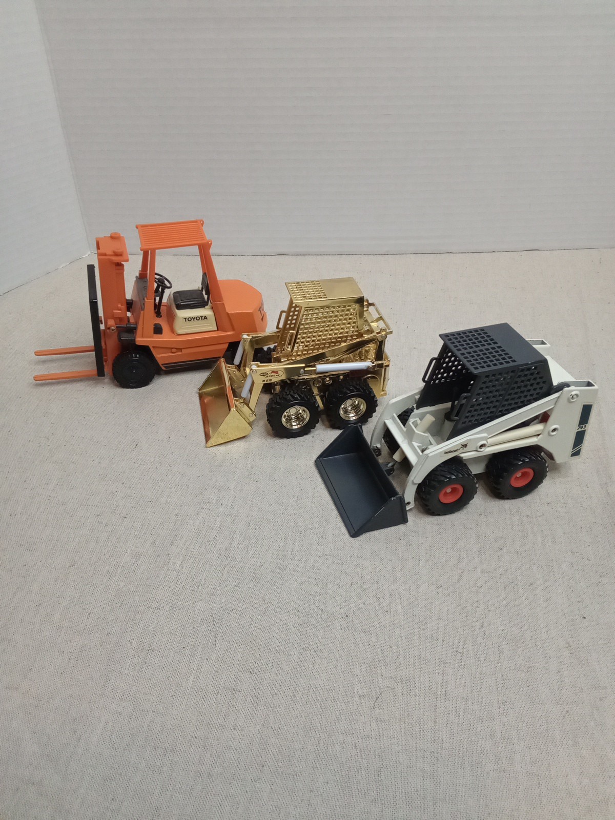 Bobcat Loader 743 , Yonezawa Toys Forklift Toyota, Gold Bobcat Loader M-610