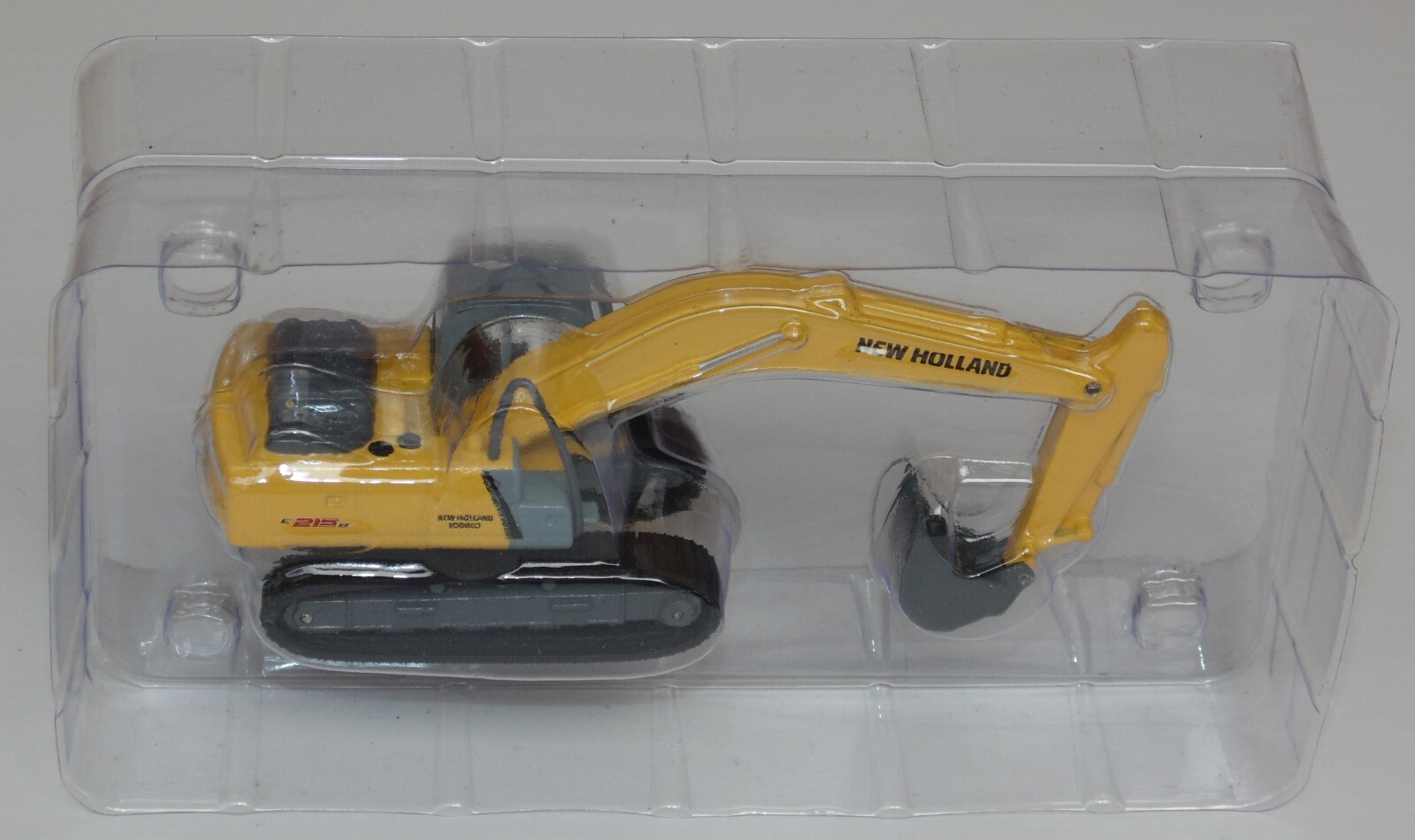 NEW HOLLAND E215B RETROEXCAVA MAQUINARIA PARA CONSTRUCCION 1:87 DIECAST COLOMBIA