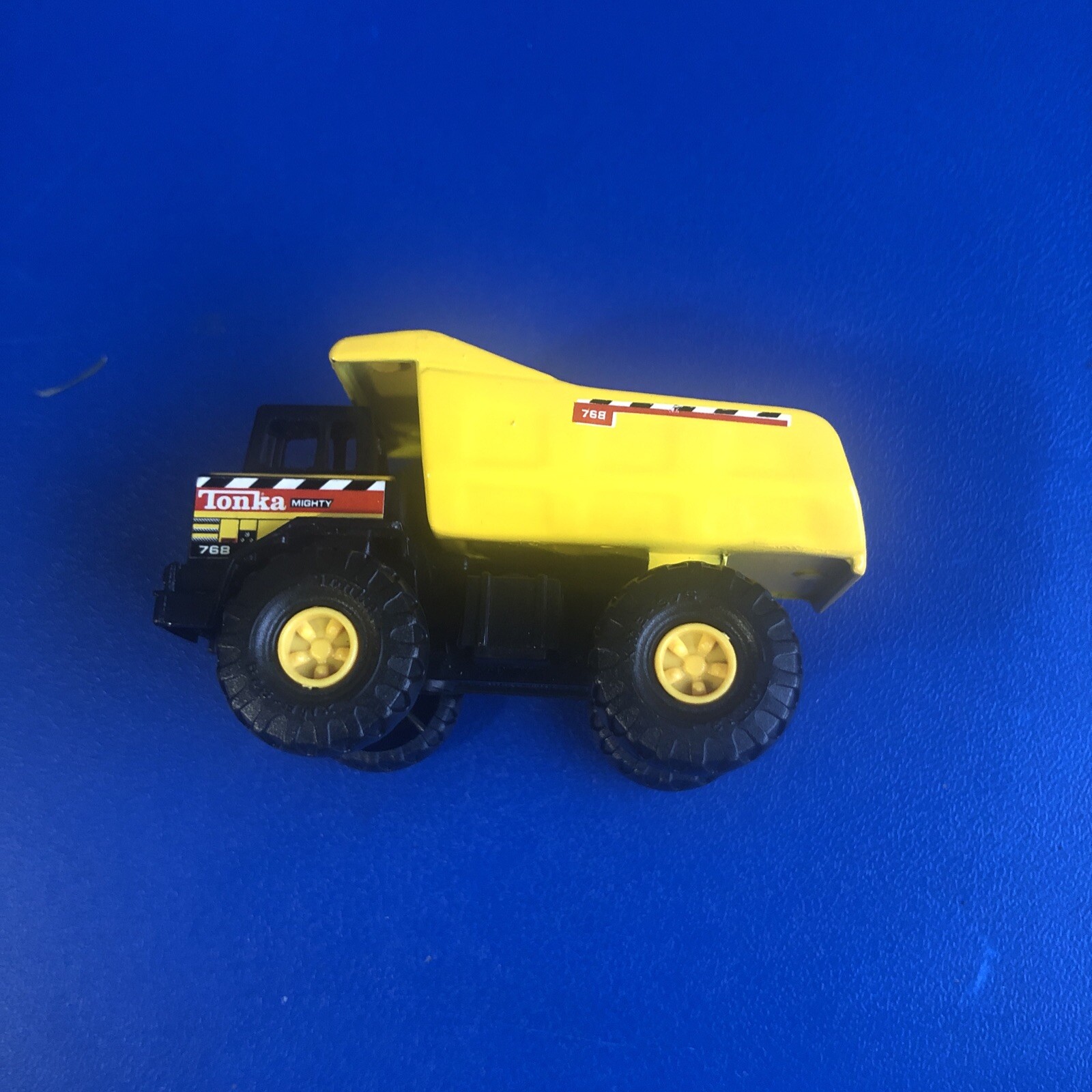 Tonka #768 Diecast 1998 3” Mighty Dump Truck Yellow.