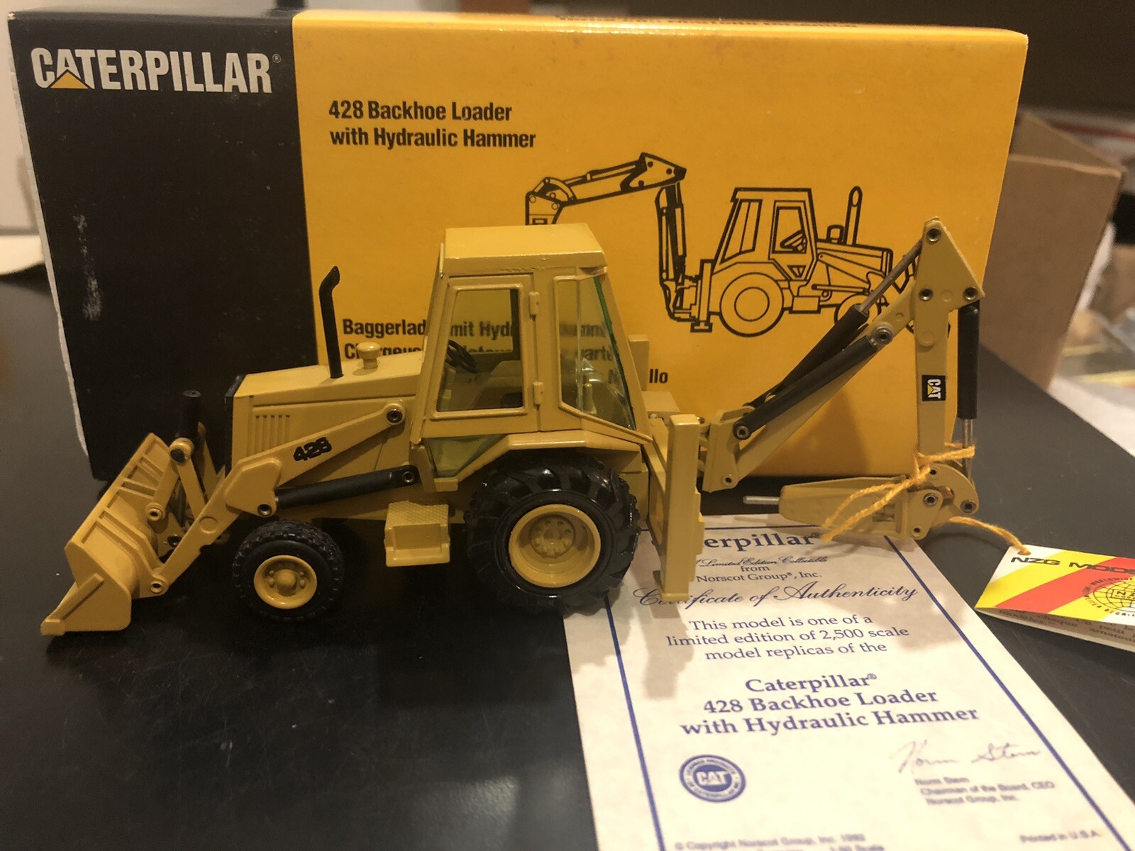 NZG #378 CAT Caterpillar 428 Backhoe Loader w/ Hammer – 1:50 – Limited Edition