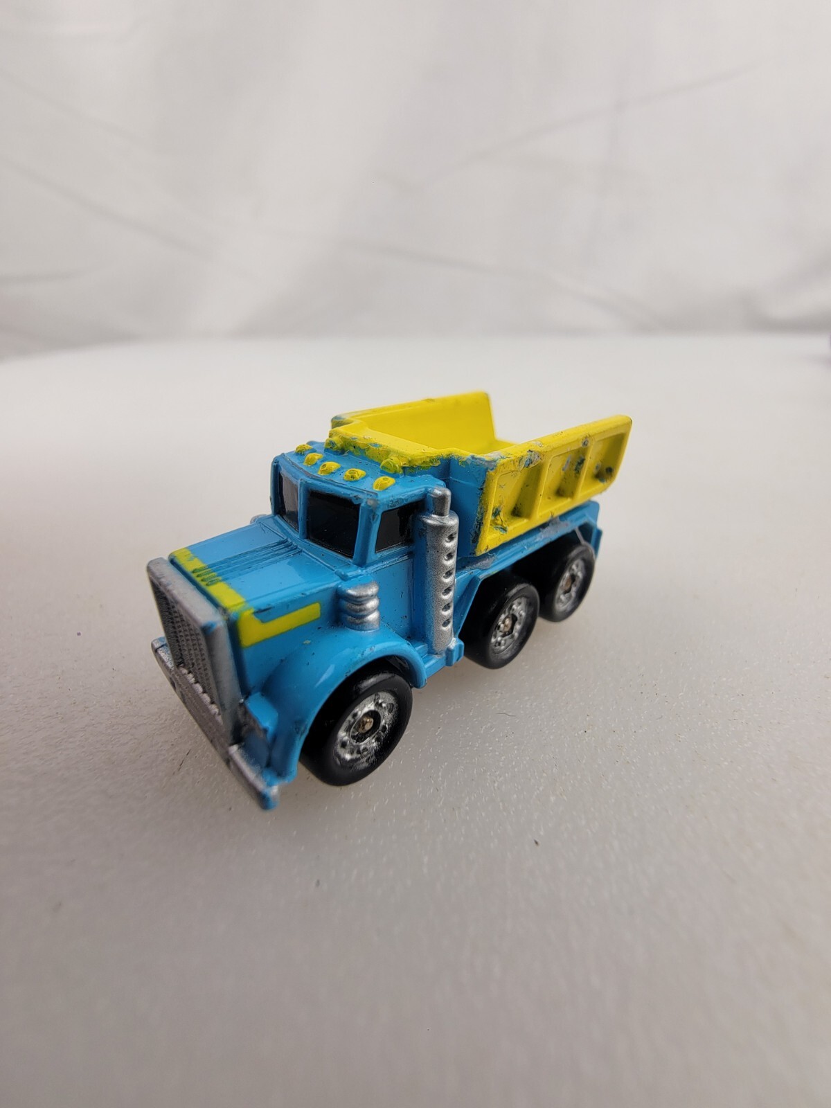 1987 Micro Machine Construction Heavy Duty 3 Axle Dump Truck in Yellow and Blue