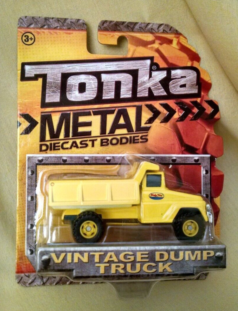 TONKA DUMP TRUCK METAL DIECAST BODIES ITEM NO 06402 NEW 2012 SEALED TOY YELLOW.