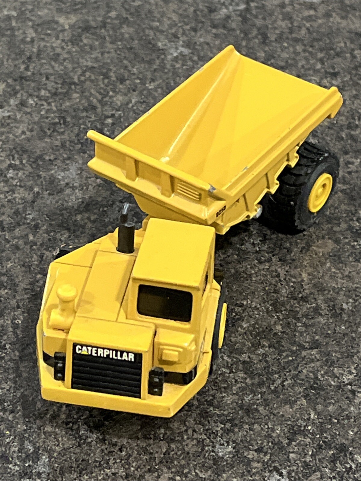 Vintage Ertl 5″ Articulated Caterpillar – D250, Rock Hauler Dump Truck – Yellow