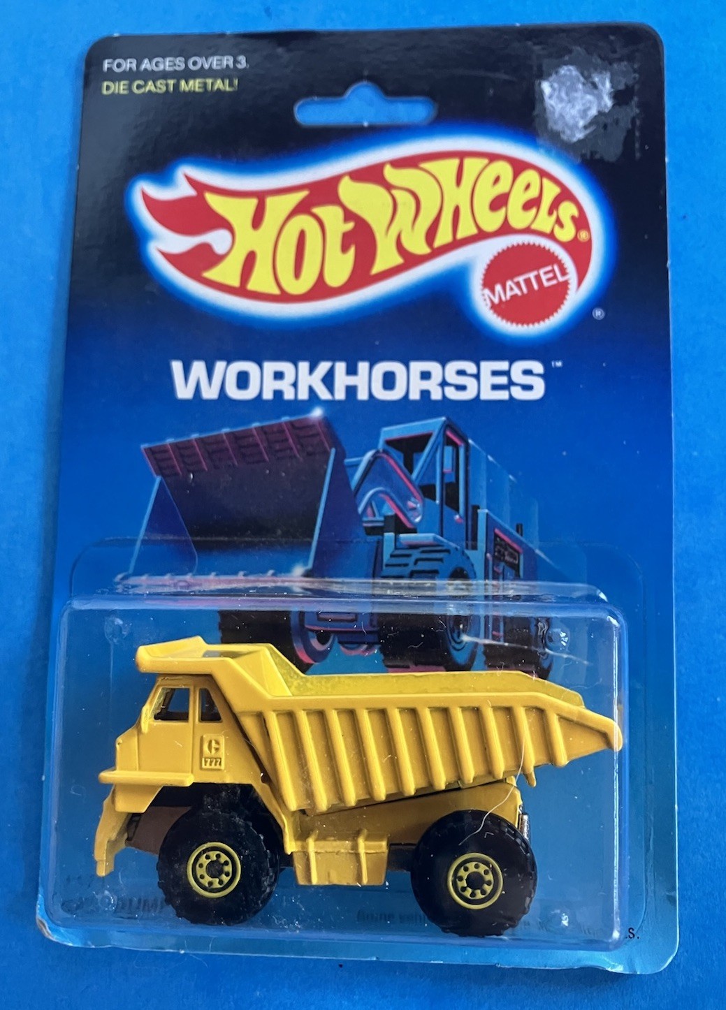 1983 Hot Wheels Workhorses Cat Dump Truck 1171 in Diecast Yellow – New On Card